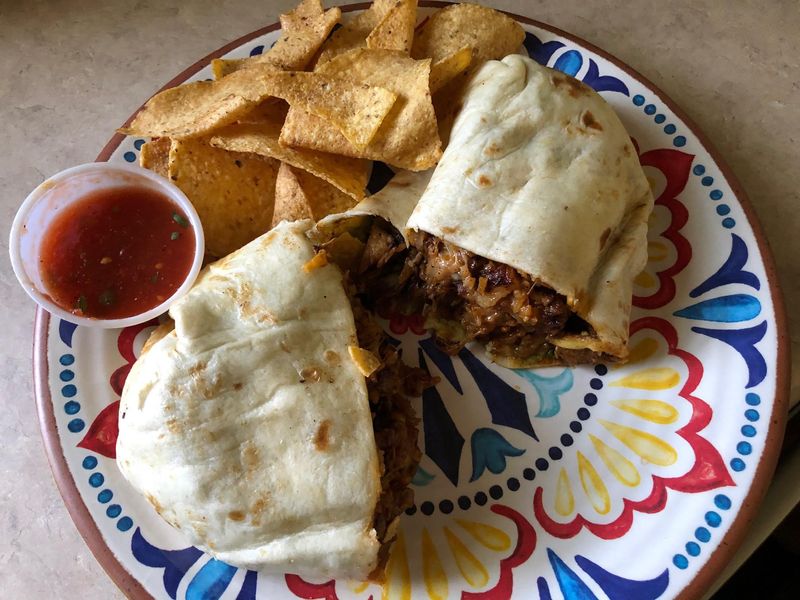 The South Beach Bomb'rito (burrito) from The Taco Joint, stuffed with pork al pastor and all kinds of flavor.