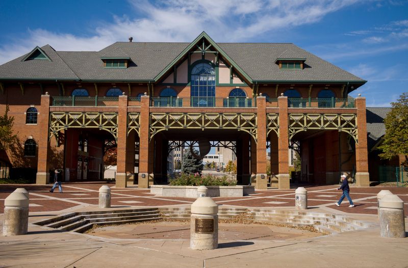 DAVID ZALAZNIK/JOURNAL STAR Walkers on the Peoria riverfront pass the Gateway Building.