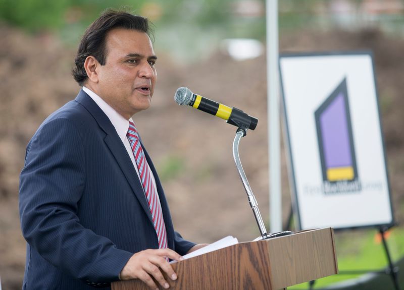 Sunil Puri, founder and president of First Rockford Group, speaks at the groundbreaking ceremony Monday, June 23, 2014, for Rockford Health Physicians’ new clinic in Belvidere.