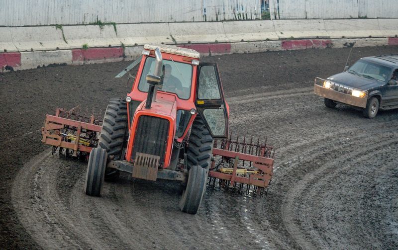 In this file photo, owner Brandon Dean helps prep the track for racing at Peoria Speedway on Farmington Road.