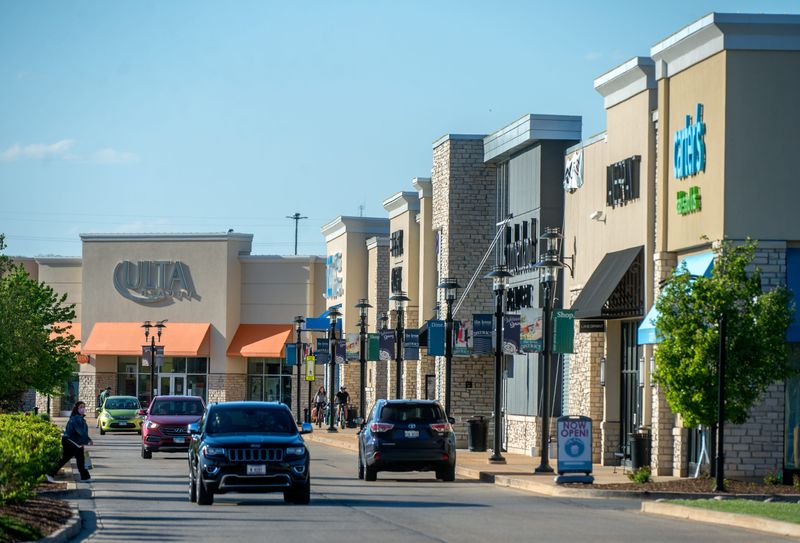 Vehicles, pedestrians and even bicyclists converge on the Levee District shopping center in East Peoria.