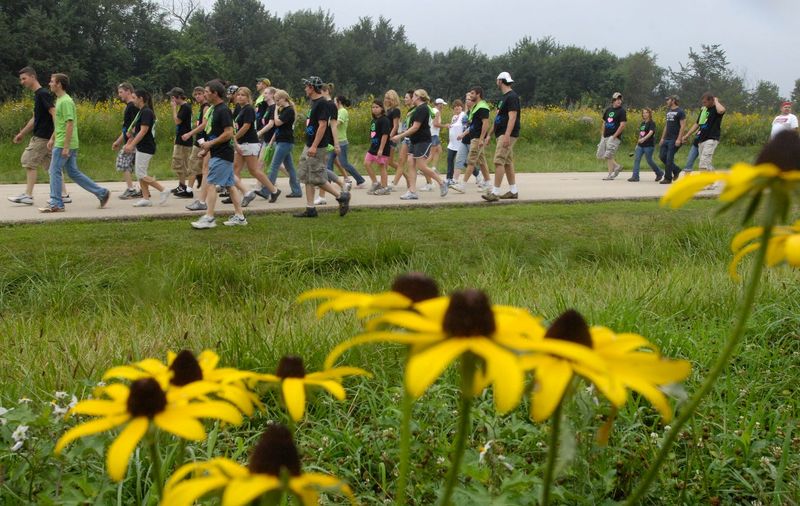 Teams of participants in the 5k run and walk travel past fields of wildflowers during Saturday's Whitney's Walk for Life at Jubilee State Park.