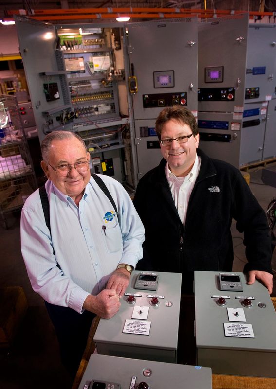 CEO Larry Tangel, right, and his dad, founder Ed Tangel, have seen their firm, Enercon Engineering, expand from a small central Illinois operation in 1975 to a player in the world market for power generation with over 200 employees.
