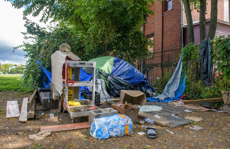 A lone tent remains on the recently abandoned homeless encampment on a vacant lot next to the Spurck Mansion on Knoxville Avenue in Peoria. About 15-20 homeless people had been living on the lot.