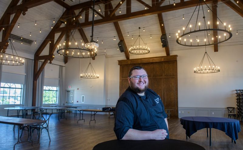 James Hubbartt, an operating partner for Childers, stands in the newly remodeled banquet hall on the top floor of the Gateway Building on the Peoria riverfront.