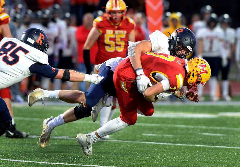 Rochester's Lance Ingold sacks Murphysboro quarterback Gibson Fager during the game Saturday, Nov. 18, 2023.