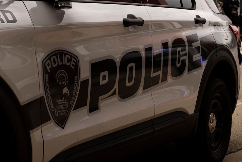Police vehicles block the sidewalk after responding to a car accident on Monday, May 14, 2024, at the intersection of South Main Street and Chestnut Street in downtown Rockford.