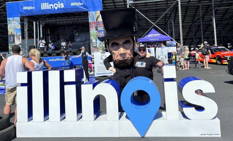 Illinois Office of Tourism's mascot Big Lincoln poses at an event on June 3, 2022. Big Lincoln recently has been digitized into an AI helping tourists plan itineraries around the land of Lincoln.
