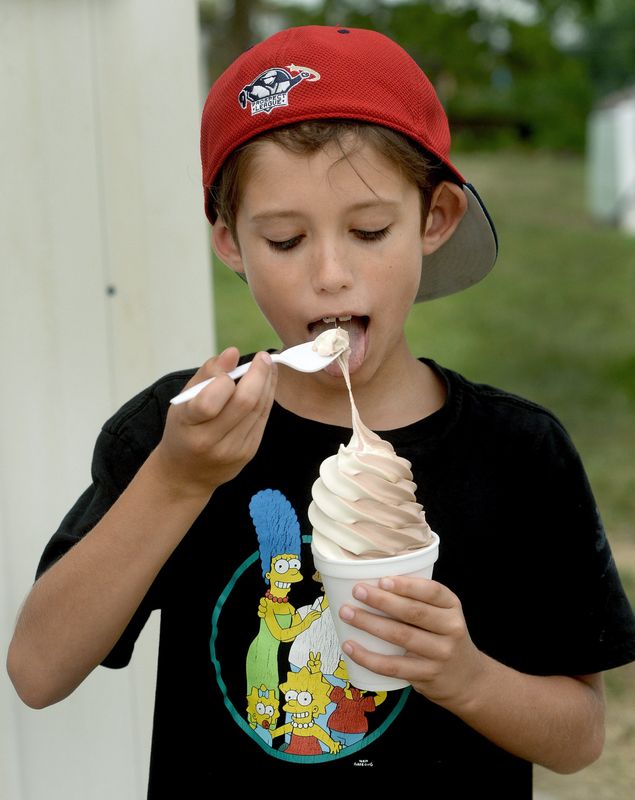 Dean Crisafulli, 9, of Washington D.C. tries some ice cream at the Illinois State Fair on Wednesday, Aug. 14, 2024, in Springfield.