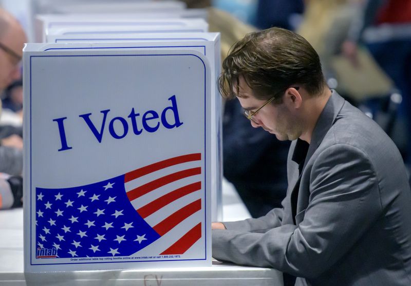 Peoria County voter Matthew Dylewski fills in his ballot Tuesday, Nov. 5, 2024 at the polling place in El Vista Baptist Church in Peoria.