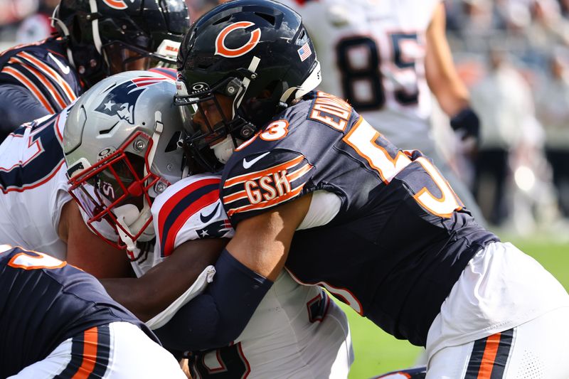 Nov 10, 2024; Chicago, Illinois, USA; New England Patriots running back Rhamondre Stevenson (38) rushes the ball against Chicago Bears linebacker T.J. Edwards (53) during the first quarter at Soldier Field. Mandatory Credit: Mike Dinovo-Imagn Images