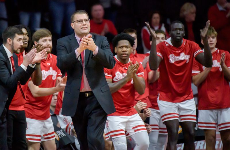 Bradley men's basketball coach Brian Wardle signed a contract extension with the school ahead of the 2025-26 season. He is 187-147 overall at Bradley, and that win total is fourth on the program's all-time list.