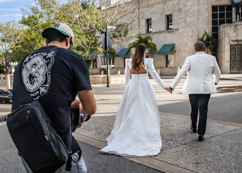 Miami based photographer Manuel Reveron takes ÒTrash the DressÓ photos of Melanie De Andrade and her husband Luis Ojeda on Worth Avenue November 14, 2024. The couple was married last year, October 21, 2023.