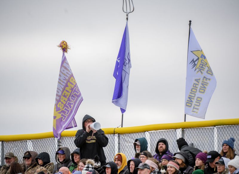 A Farmington fan wields a small megaphone to cheer on the Farmers during their Class 2A state football semifinal against Palos Heights Chicago Christian on Saturday, Nov. 23, 2024 in Farmington. The Farmers fell 34-20.
