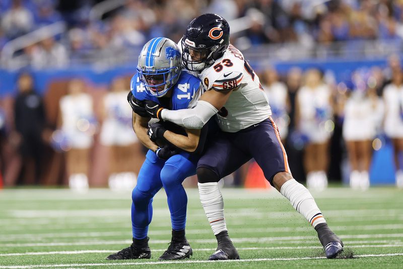 DETROIT, MICHIGAN - NOVEMBER 28: T.J. Edwards #53 of the Chicago Bears tackles Amon-Ra St. Brown #14 of the Detroit Lions during the second quarter at Ford Field on November 28, 2024 in Detroit, Michigan. (Photo by Mike Mulholland/Getty Images)