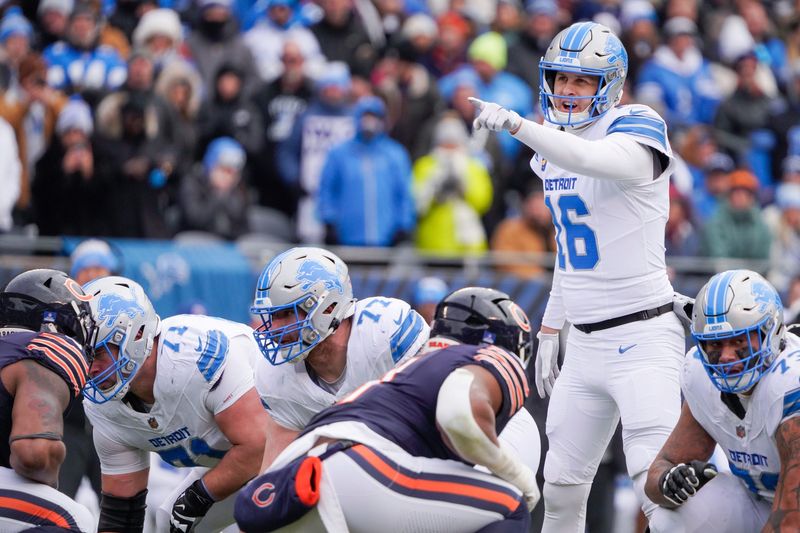 Detroit Lions quarterback Jared Goff (16) directs teammates at Soldier Field during a game against the Chicago Bears at in Chicago, Ill., on Sunday, Dec. 22, 2024.