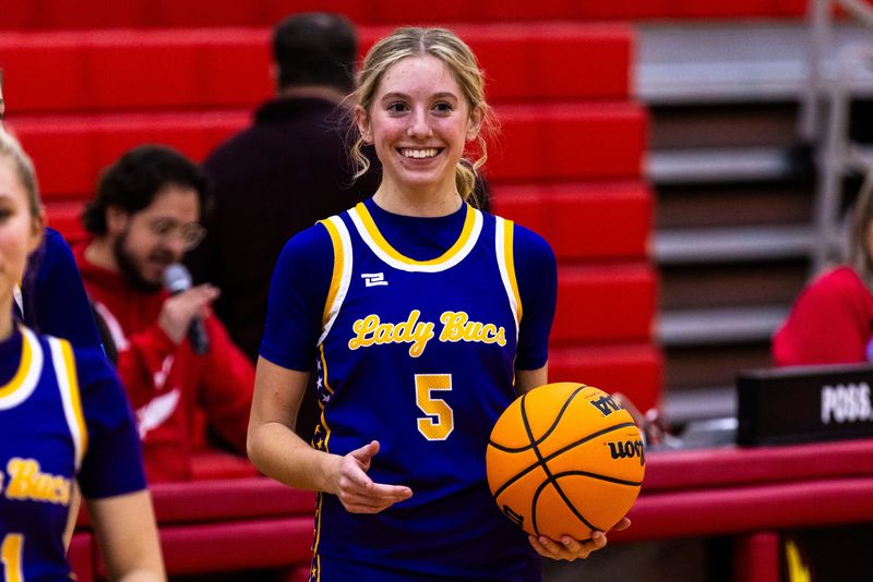 Belvidere’s Emma Pierson (5) smiles after breaking Belvidere’s all-time girls basketball scoring record during a game against Jefferson on Friday, Jan. 10, 2025, at Jefferson High School.