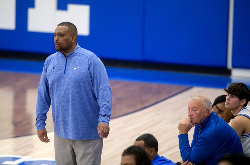 Limestone head coach Willie Coleman, left, and assistant coach Eddie Mathews watch the action as the Rockets battle Richwoods in the second half of their high school basketball game Friday, Jan. 10, 2025 in Bartonville. The Knights defeated the Rockets 50-45.