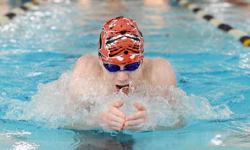 Riley Herr swims the 100 yard breaststroke during the Boys City Meet Tuesday, Jan. 29, 2025.