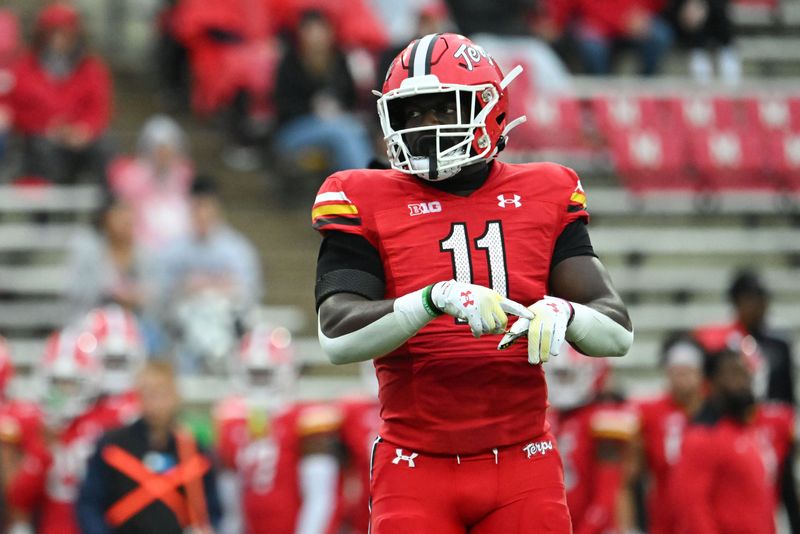 Oct 14, 2023; College Park, Maryland, USA; Maryland Terrapins linebacker Ruben Hyppolite II (11) points to his hand during the first half against the Illinois Fighting Illini at SECU Stadium. Mandatory Credit: Tommy Gilligan-USA TODAY Sports