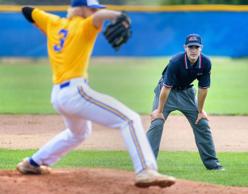 Limestone senior and prospective umpire Dylan Poulsen keeps an eye on the action during a baseball scrimmage Saturday, Aug. 20, 2022 at Illinois Central College in East Peoria. Poulsen and about a dozen other umpires took part in the clinic to brush up on their skills and techniques.