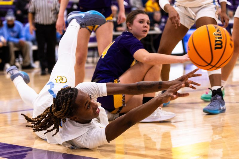 Guilford’s Zariah Burnett (5) passes the ball before falling out of bounds during the 4A girls basketball regional championship on Thursday, Feb. 20, 2025, at Hononegah High School.
