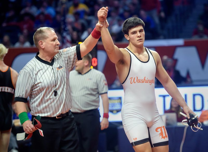 Washington's Josh Hoffer celebrates his 5-0 decision over Waterloo's Jaxson Mathenia in the 215-pound final of the Class 2A state high school wrestling championships Saturday, Feb. 22, 2025 at the State Farm Center in Champaign.
