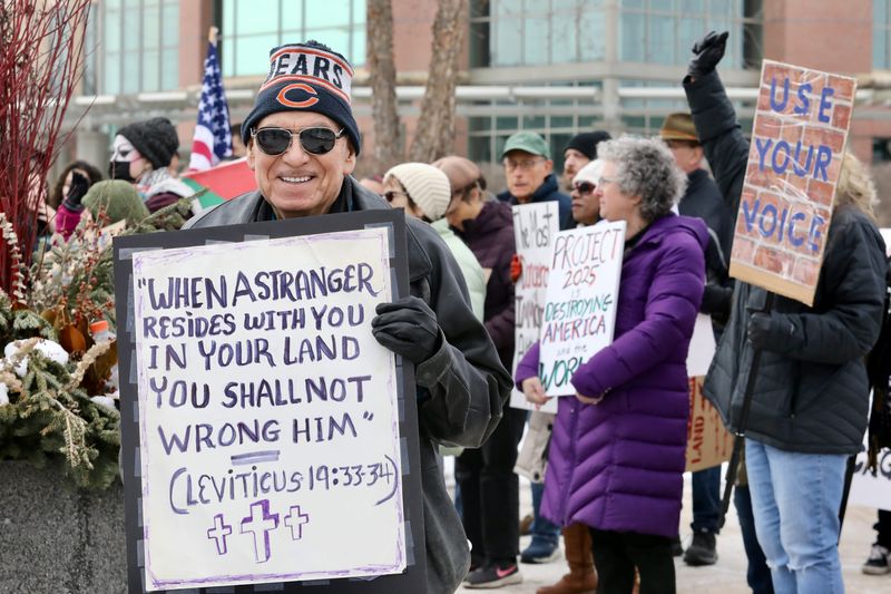 More than 100 people participated in a rally and march Sunday, Feb. 23, 2025, in downtown Rockford to support the region's immigrant community.