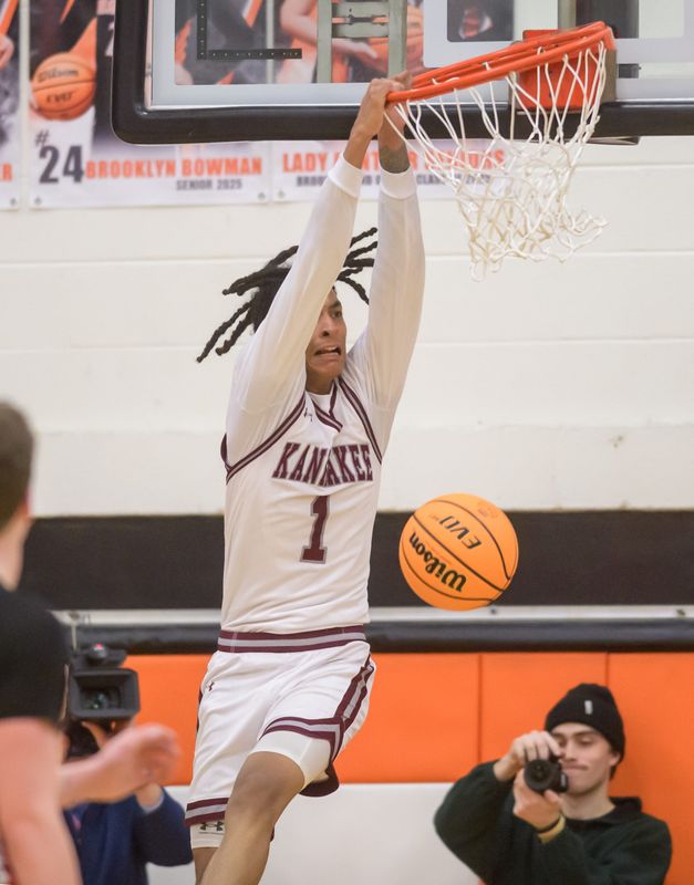 Kankakee’s Lincoln Williams dunks over Metamora in the second half of the Class 3A Washington Sectional semifinal Tuesday, March 4, 2025 at Washington Community High School. The Redbirds' rallied to defeat Kankakee 65-63 in overtime.