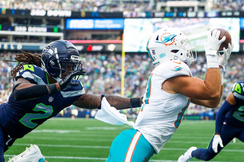 Sep 22, 2024; Seattle, Washington, USA; Seattle Seahawks safety Rayshawn Jenkins (2) covers Miami Dolphins tight end Durham Smythe (81) during the fourth quarter at Lumen Field. Mandatory Credit: Joe Nicholson-Imagn Images