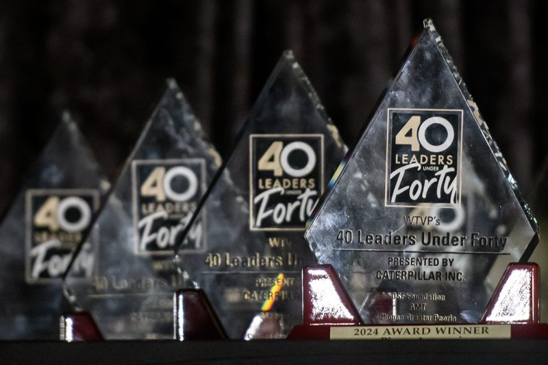 Trophies are lined up on a table before the start of the 31st 40 Leaders Under Forty gala Tuesday, March 18, 2025 at the Par-A-Dice Hotel & Casino in East Peoria.