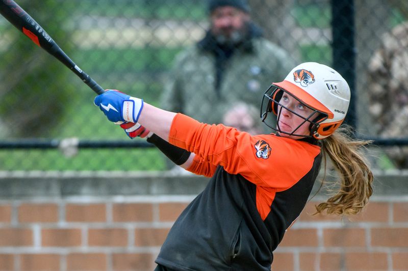 Illini Bluffs’ Sara Finn watches the ball sail out of the park on a home run against Dunlap on Tuesday, April 1, 2025 at Dunlap High School.