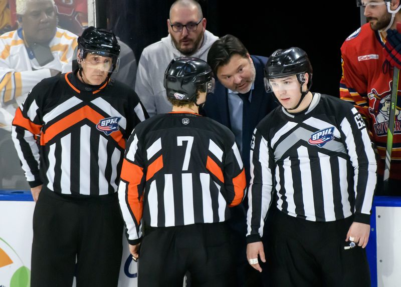 Peoria Rivermen head coach Jean-Guy Trudel questions the on-ice officials about a game-tying goal by Quad City in the final seconds of the third period of Game 1 of the first round of the SPHL hockey playoffs Thursday, April 10, 2025 at Carver Arena. The Rivermen defeated Quad City 5-4 in sudden-death overtime.