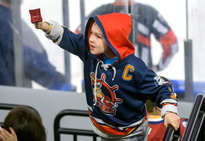 A young fan rings a bell to get the attention of the Rivermen mascot in the first period of Game 1 of the SPHL semifinals Wednesday, April 16, 2025 at Carver Arena. The Rivermen fell to the Evansville Thunderbolts 2-0.