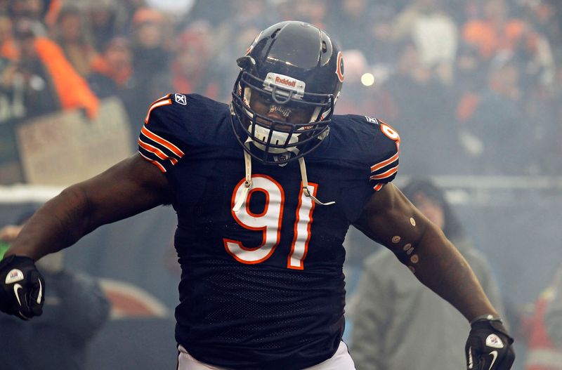 Dec 26, 2010; Chicago, IL, USA; Chicago Bears defensive tackle Tommie Harris (91) takes the field against the New York Jets at Soldier Field. Mandatory Credit: Mike DiNovo-USA TODAY Sports