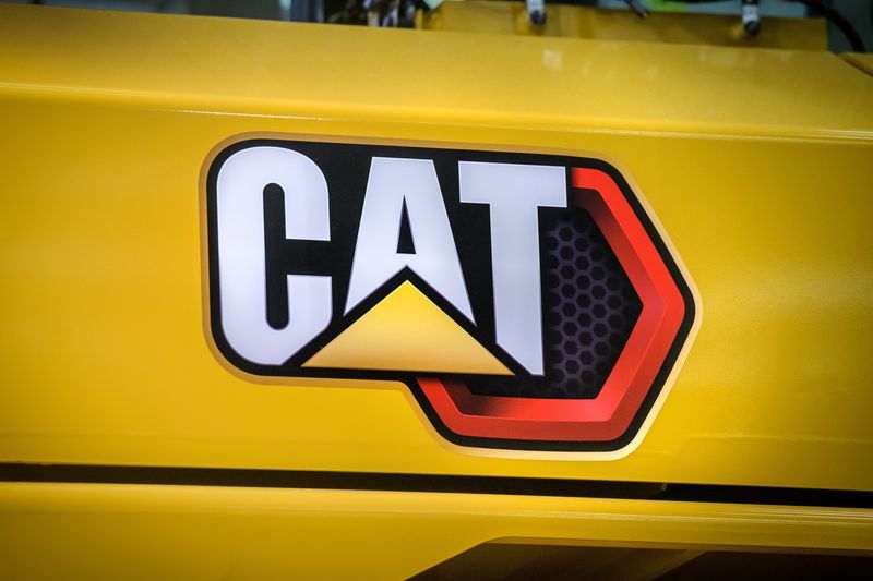 A Caterpillar logo is surrounded by yellow on the side of a tractor in the Building SS assembly facility in East Peoria.