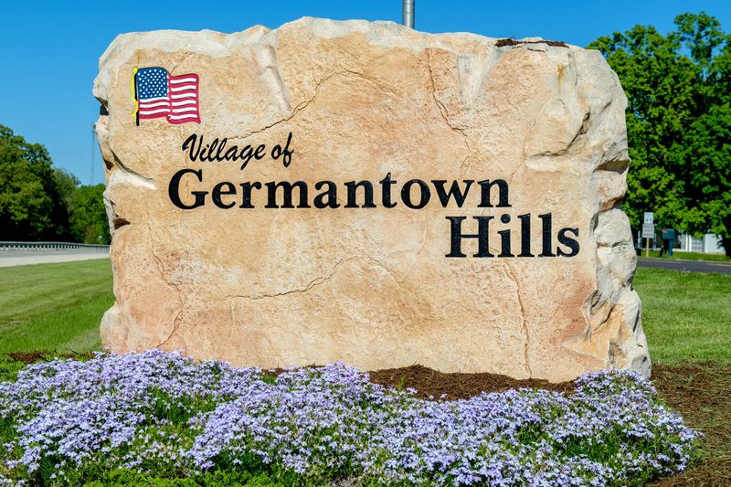 A large stone sign along eastbound Rt. 116 marks the village of Germantown Hills.