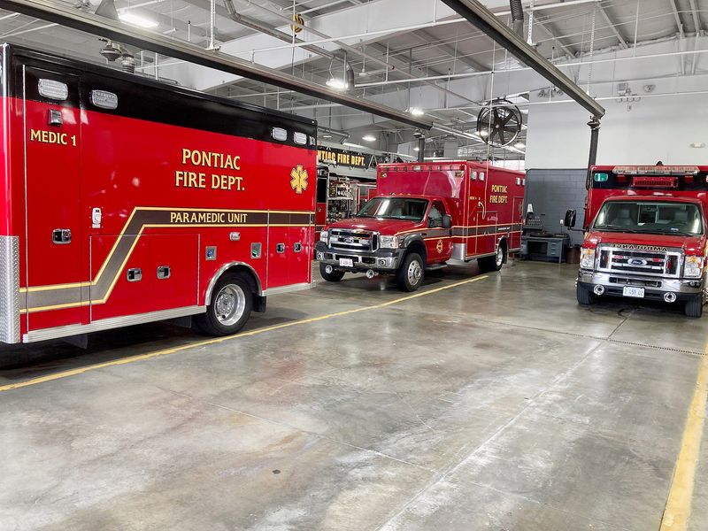 Three of the five ambulances in the Pontiac Fire Department's fleet sit in the department's garage recently. PFD Chief Jacob Campbell was recently given approval to apply for a grant that will add one firefighter to the department. All PFD firefighters are required to be cross-rained in firefighting and EMT or paramedic licensing to help with the ambulance service.