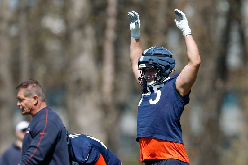 May 9, 2025; Lake Forest, IL, USA; Chicago Bears offensive line Ozzy Trapilo (75) warms up during the Rookie Minicamp at Halas Hall. Mandatory Credit: Kamil Krzaczynski-Imagn Images