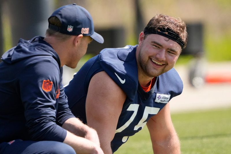 May 10, 2025; Lake Forest, IL, USA; Chicago Bears head coach Ben Johnson talks with offensive lineman (75) Ozzy Trapilo during rookie minicamp at Halas Hall. Mandatory Credit: David Banks-Imagn Images