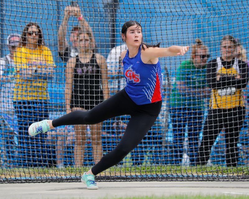 Carlinville senior Hannah Gibson twists her body in preparation to release the discus during the IHSA Class 1A state track and field finals on Saturday, May 24, 2025 at O'Brien Field in Charleston. Gibson won the 1A discus title with a throw of 141-feet, 8-inches.