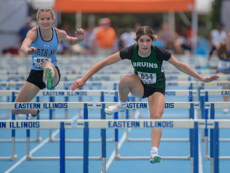 St. Bede’s Lily Bosnich (654) clears a hurdle on the way to second place in the Class 1A state 100-meter hurdles Saturday, May 24, 2025 at Eastern Illinois University in Charleston.