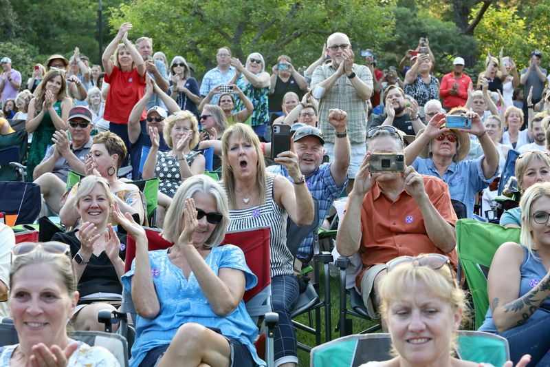 Audience members react to performers Tuesday, June 20, 2023, during Tuesday Evening in the Gardens at Anderson Japanese Gardens in Rockford.