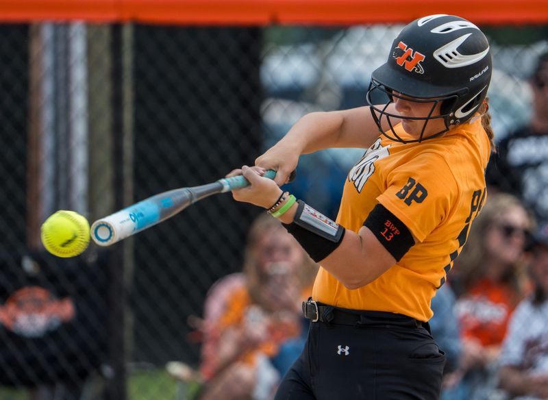Washington’s Addy MacGregor makes contact with a Bloomington pitch in the sixth inning of the Class 3A Washington Regional softball title game Friday, May 30, 2025 in Washington. The Panthers defeated the Raiders 10-0 in six innings.