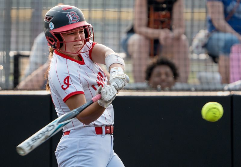 Brimfield/Elmwood’s Reese Legaspi takes a powerful swing at a Beecher pitch in extra innings during the Class 2A softball supersectional Monday, June 1 at Eastside Centre in East Peoria. The Bobcats defeated the Indians 4-3 in ten innings.