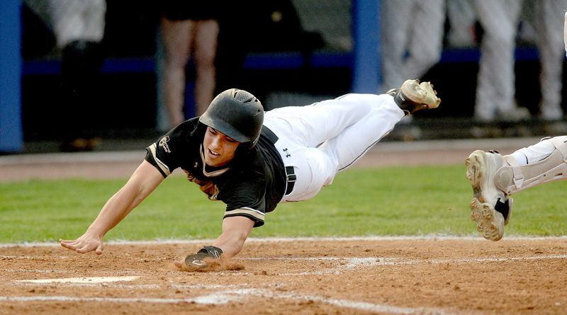 Sacred Heart-Griffin's Drake Weeks dives for home plate as he scores against Monticello during the Class 2A Lincoln Land Community College Supersectionals Monday June 2, 2025.