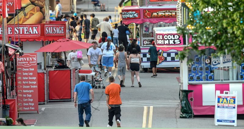 People arrive for the Great Anderson County Fair opening day at the Anderson Sports and Entertainment Complex Thursday, May 1, 2025.