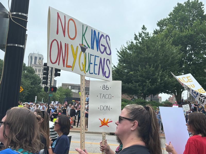 Lindsay Roth of Edwardsville holds a "No Kings, Only Queens," sign at a No Kings protest and march at the Illinois Capitol in Springfield on June 14, 2025.