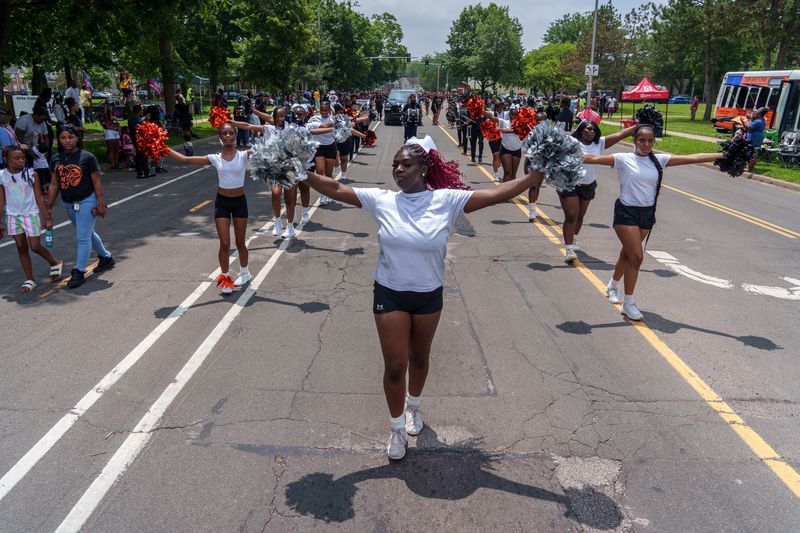 The Manual High School cheer squad and drumline lead the Ernestine Jackson Juneteenth Freedom Day Parade on Saturday, June 14, 2025 in Peoria.