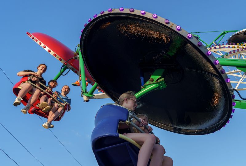 All ages enjoy a little time high in the air on the Paratrooper carnival attraction in Metamora during the Old Settlers Days festival on June 20, 2025.